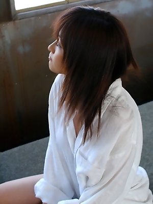 Pretty Asian teen model shows off her tits then her round ass and pussy